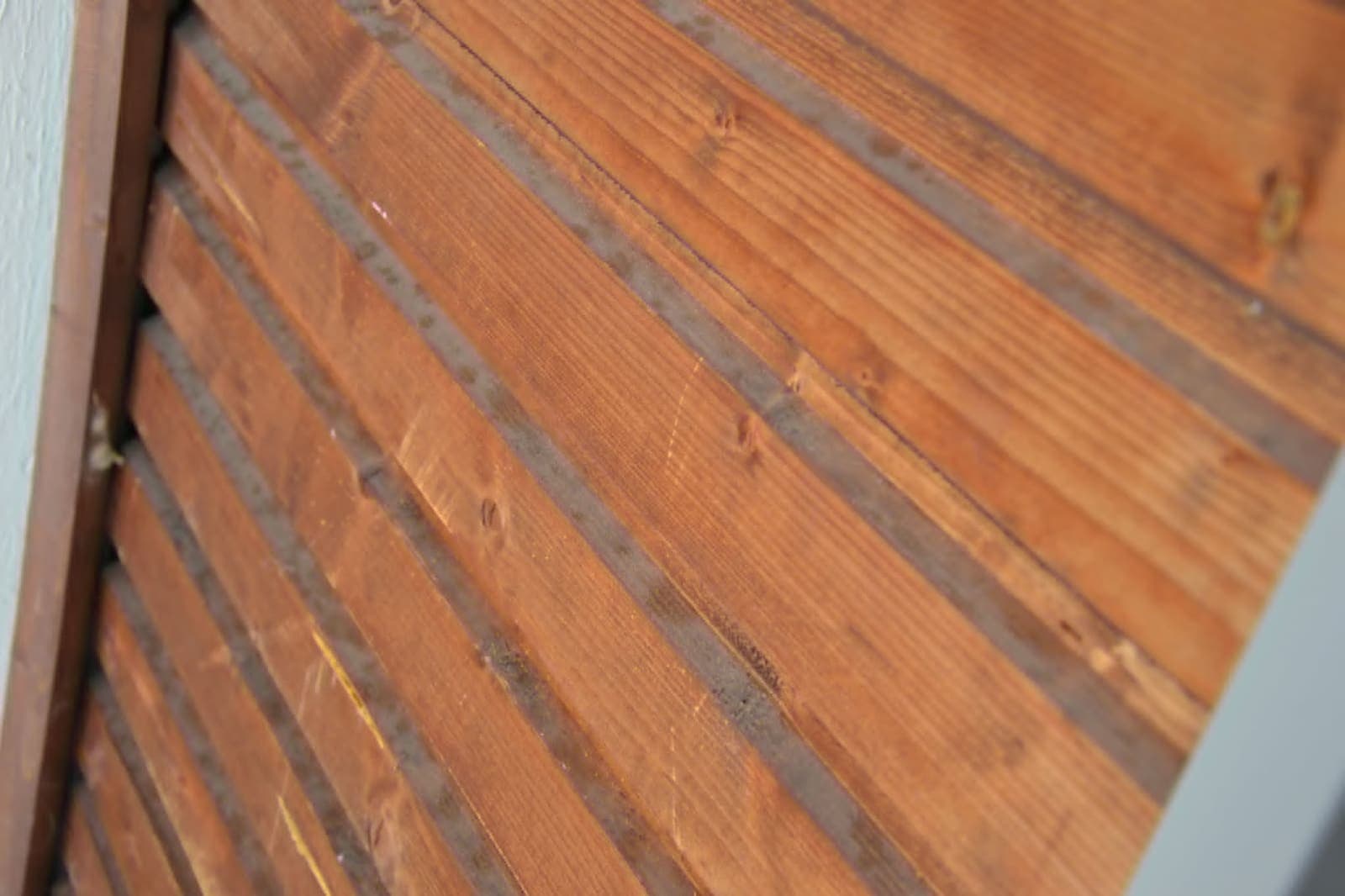 Balcony timber cladding cleaned up — Before