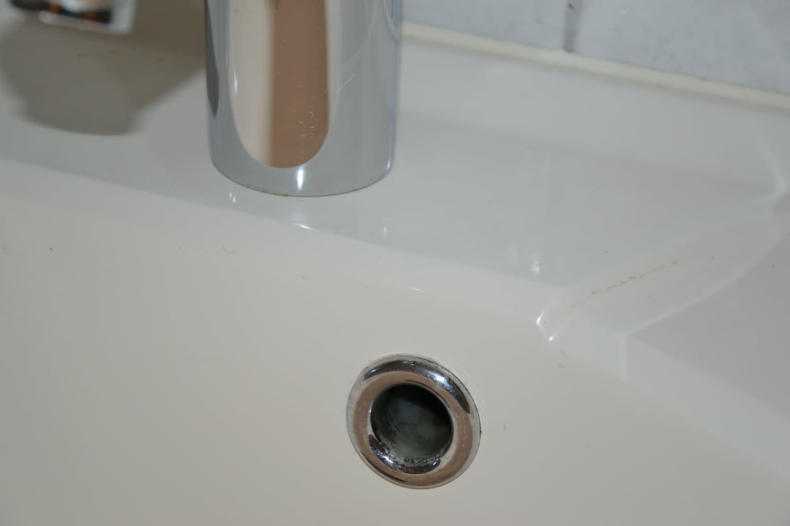 Bathroom basin drain scrubbed clean — After