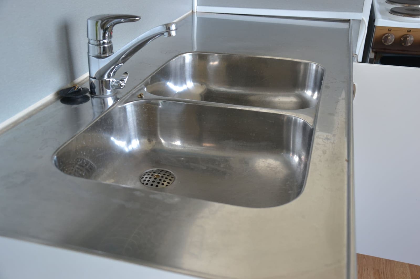 Kitchen sink polished to a shine — Before