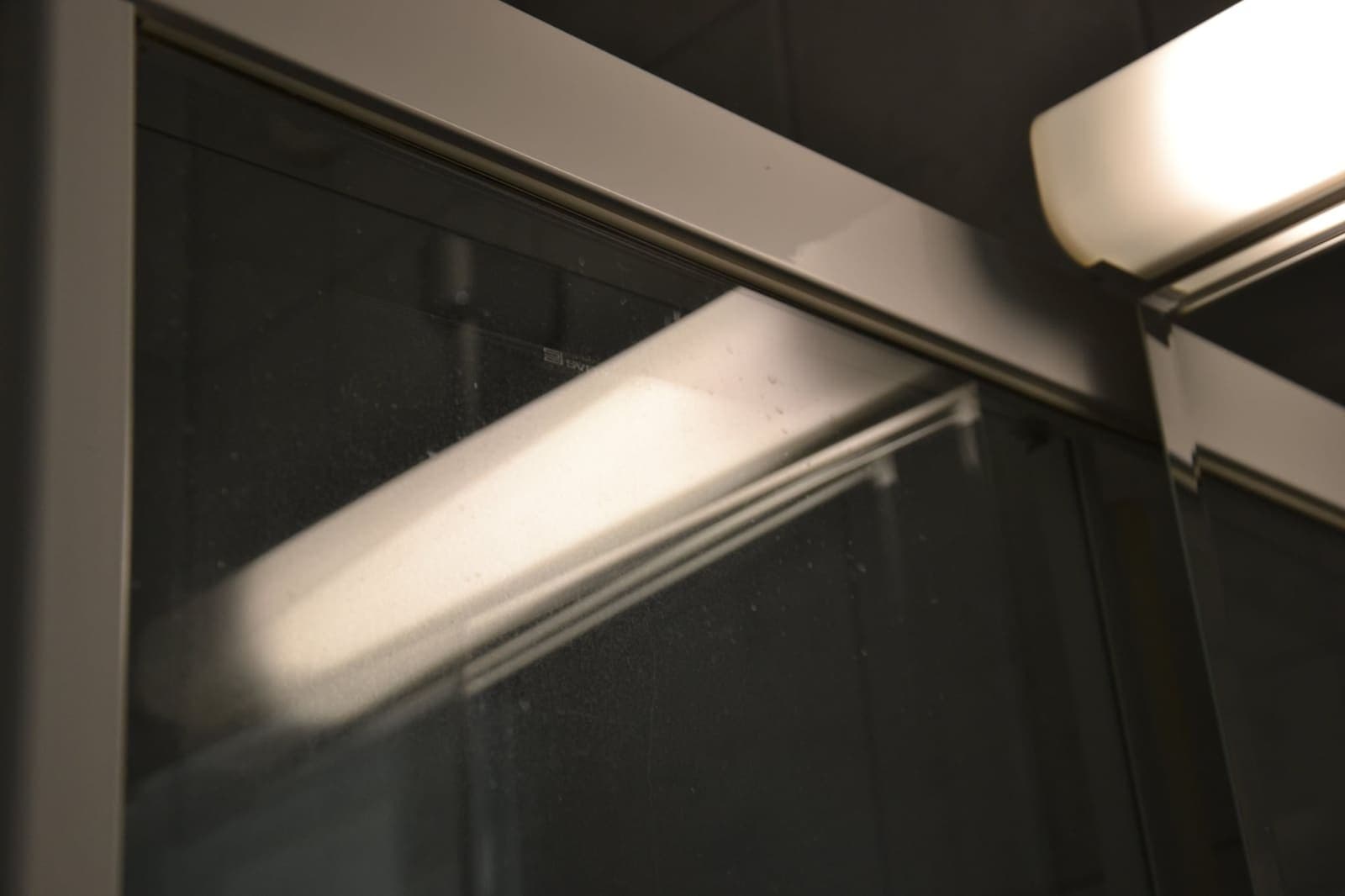 Shower screen — limescale and streaks gone — Before